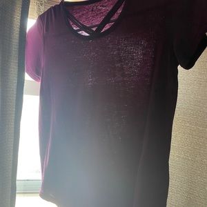 art class purple/maroon top with cross cross detailing on the front